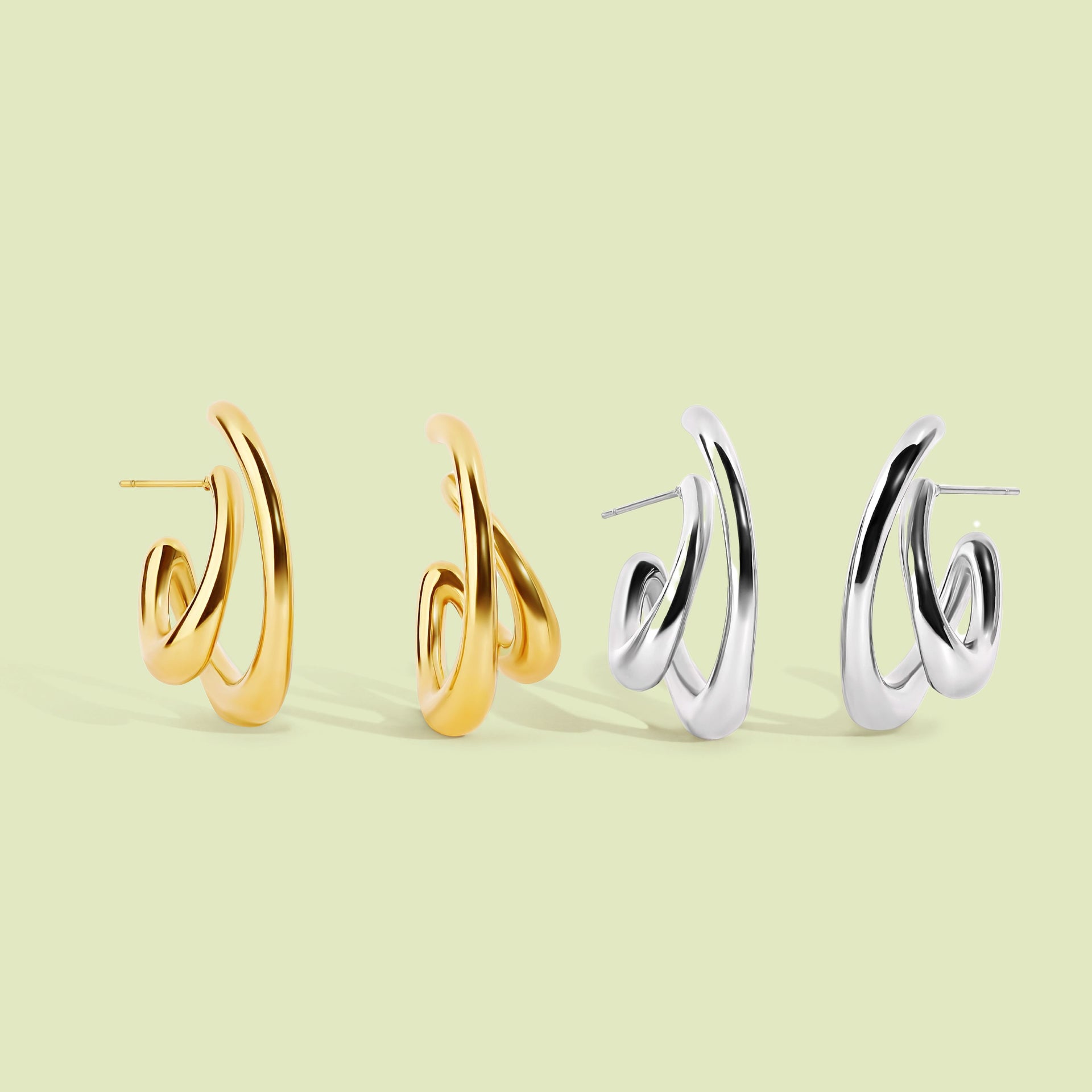 lay flat image of gold and silver earrings